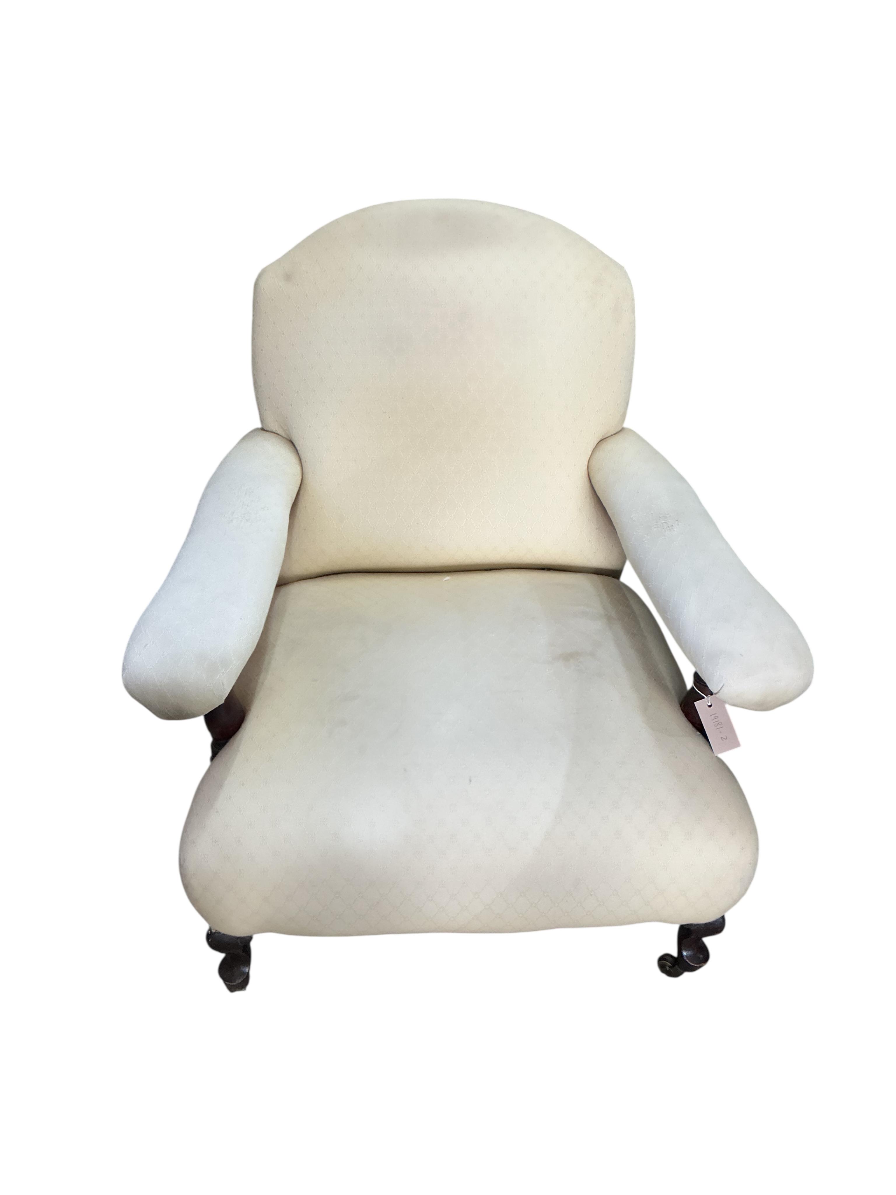A late Victorian upholstered open armchair, width 78cm, depth 80cm, height 78cm